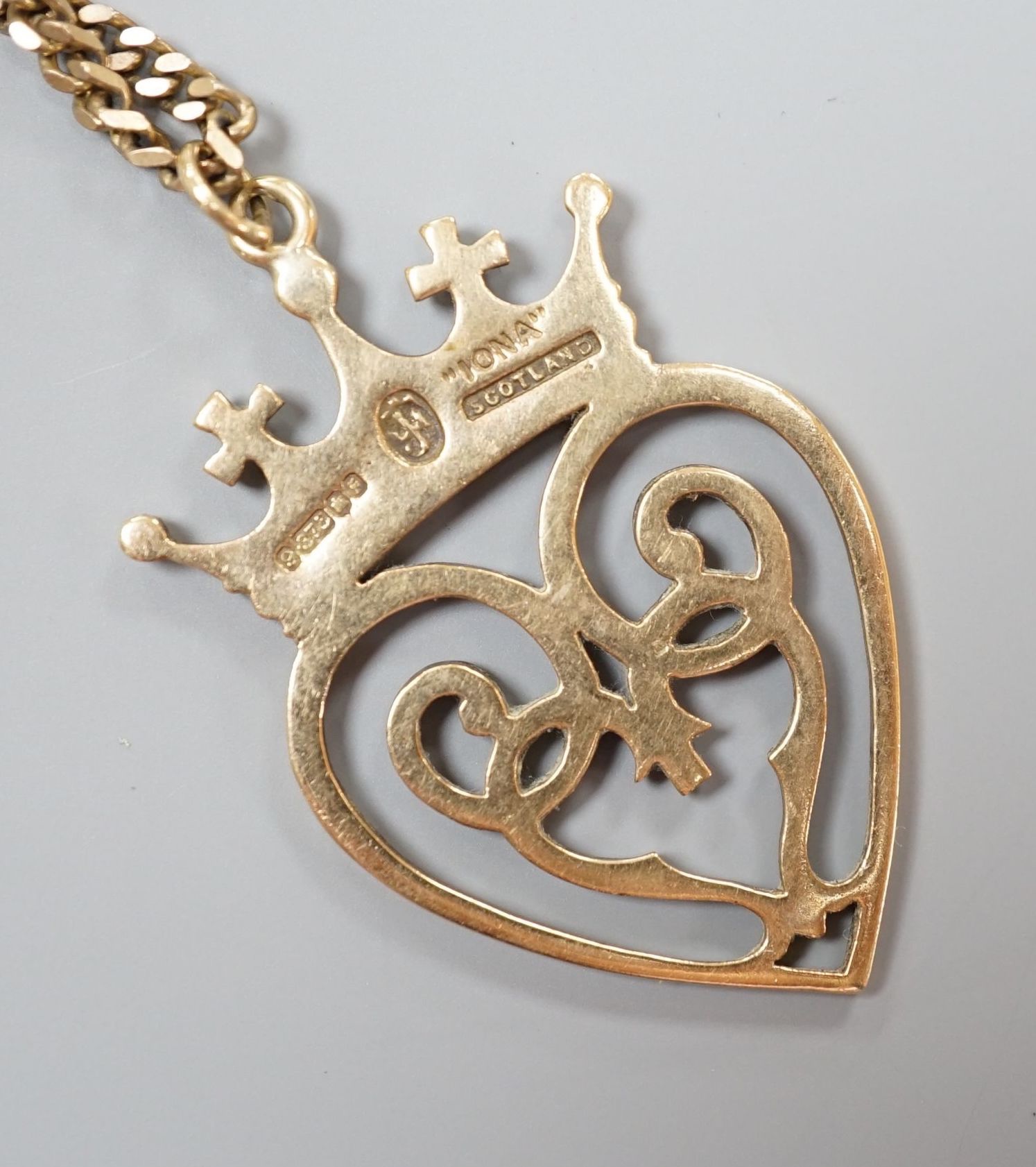 A 1970's Scottish 9ct gold Iona heart shaped pendant, 46mm, on a 9ct gold chain, 74cm